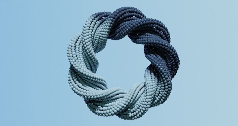 Close-up of rope against blue background