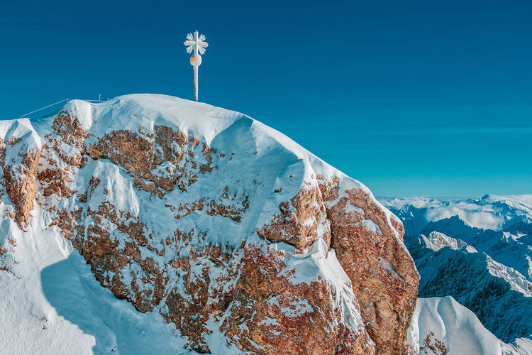 The summit cross on the zugspitze east summit, bavaria germany.