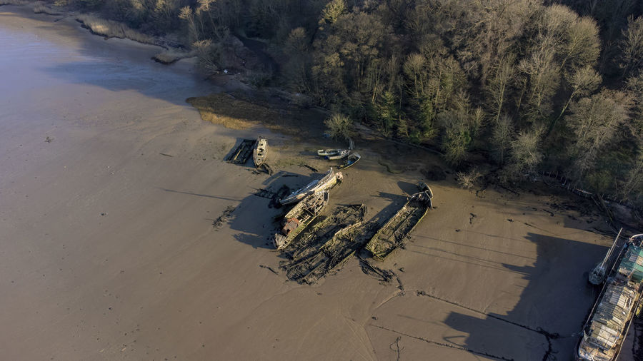 An aerial view of the remains of old boats on the river orwell at pin mill, suffolk, uk