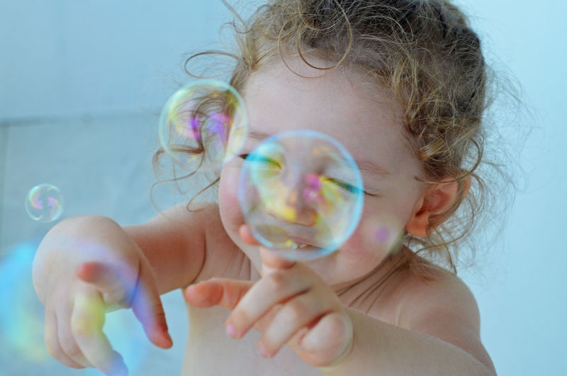 Close-up portrait of girl with bubbles