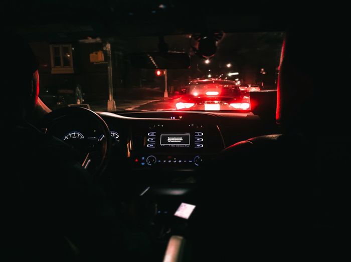 Cars on illuminated street light