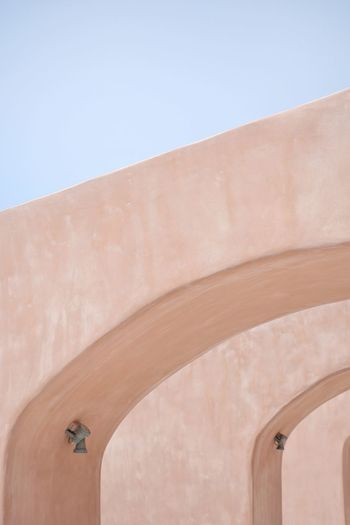 Low angle view of wall against clear sky