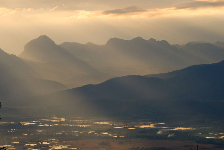 Landscape against silhouette mountain range