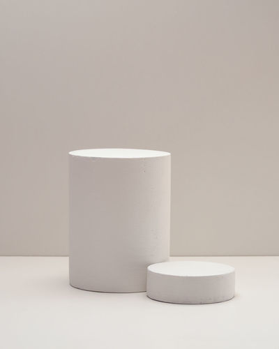 Close-up of white stack on table