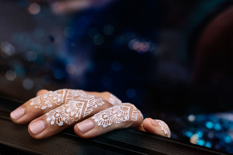 Close-up of cropped hand with tattoo