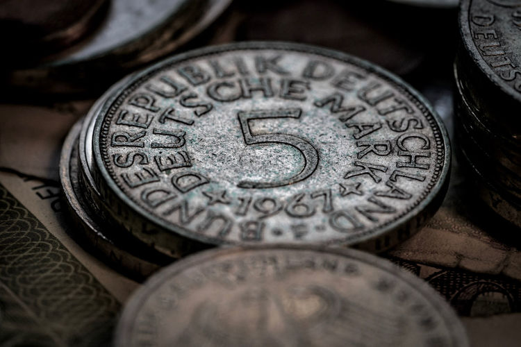 Close-up of old coins on table