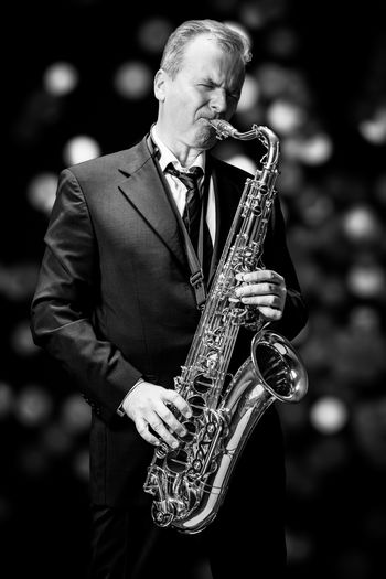 Man playing saxophone at night