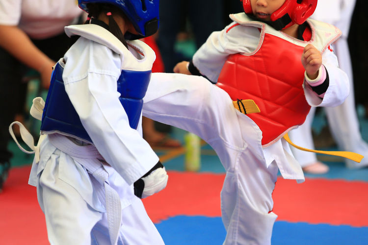 Children on taekwondo training in gym