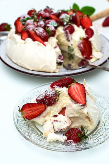 Homemade cake pavlova with strawberries on top - sweet food