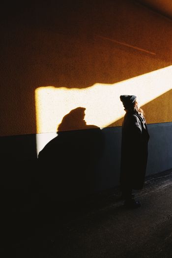 Shadow of woman on wall