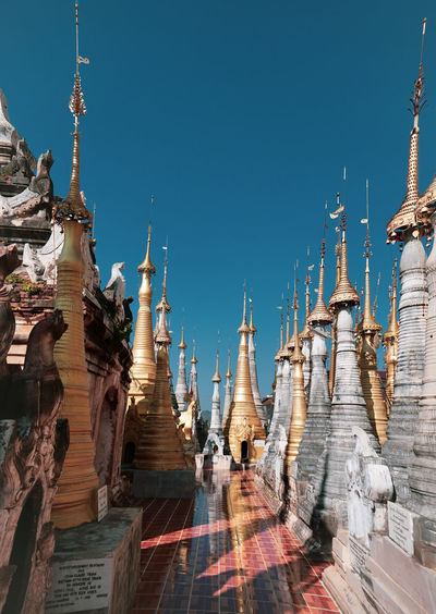 Panoramic view of temple building against blue sky