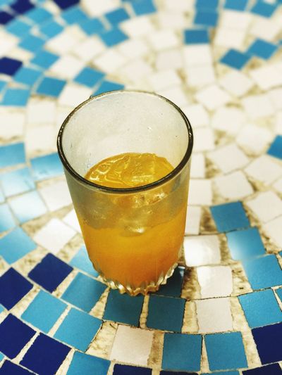 High angle view of drink on tiled floor