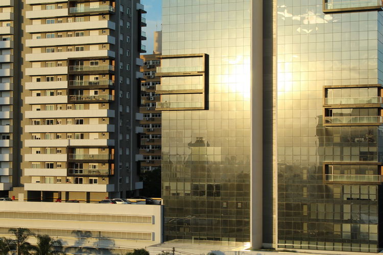 Reflection of buildings on glass window