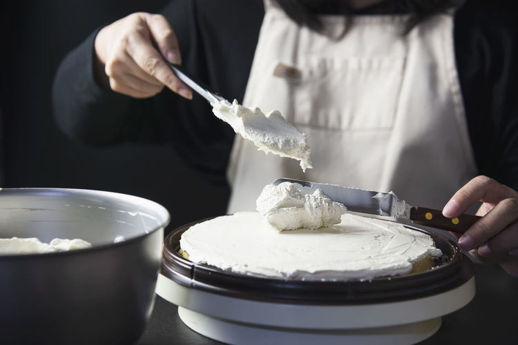Midsection of woman preparing food