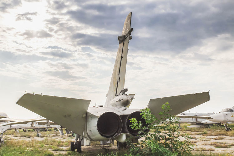 Old jet plane stands at an abandoned airfield