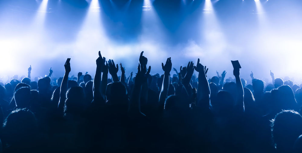 Panoramic view of crowd at music concert