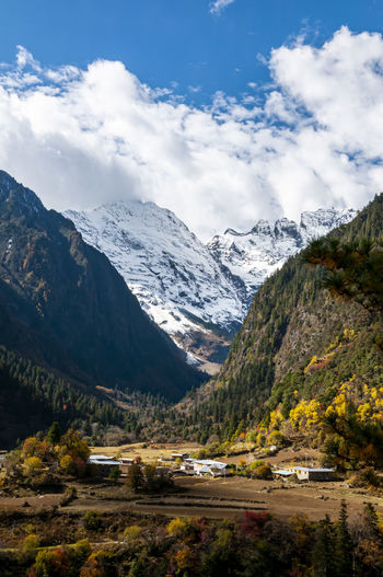 A small tibetan village at the foot of meili snow mountain in the autumn