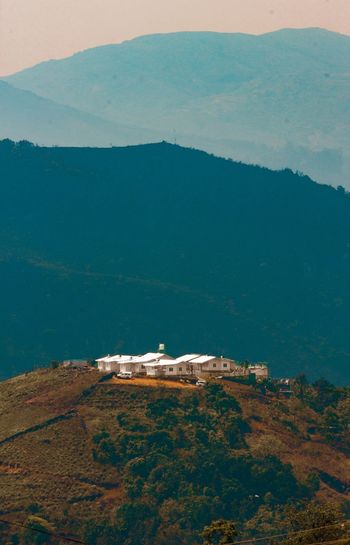 High angle view of sea and mountains against sky