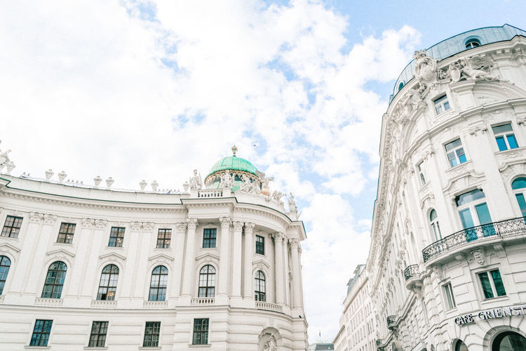 Low angle view of historical building against cloudy sky