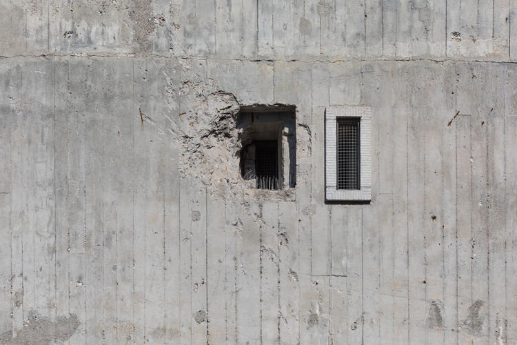 Full frame shot of damaged building exterior of a bomb shelter, war memorial