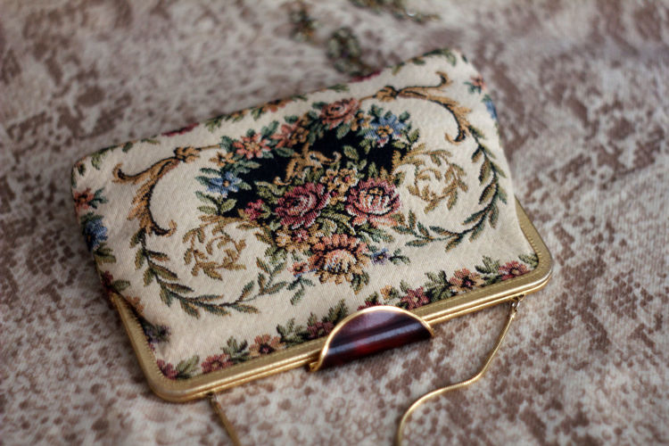 Close-up view of purse on bed