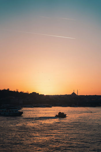 Scenic view of sea against clear sky during sunset