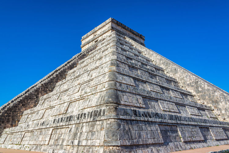 Low angle view of historical building against blue sky