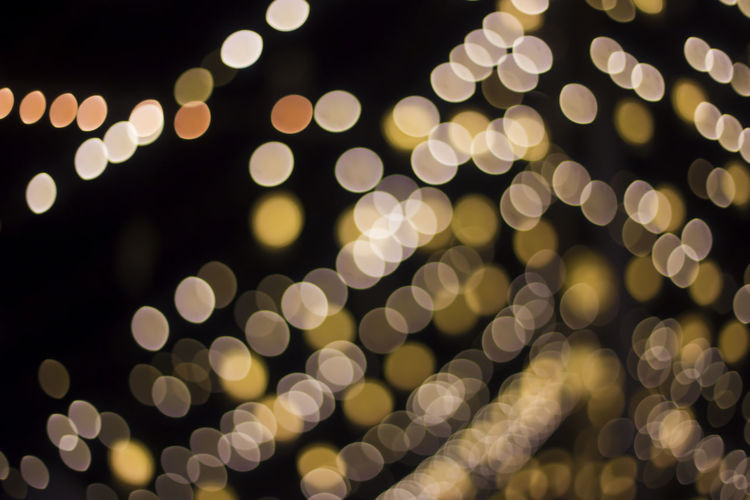 Defocused image of illuminated lights at night