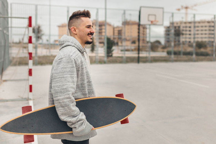 Young man skateboarding on skateboard in city