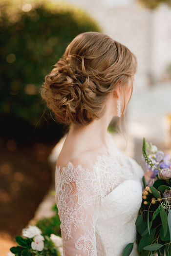 Close-up of bride looking away while standing outdoors