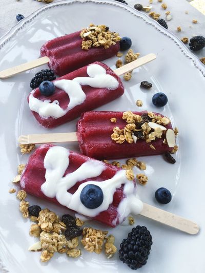 Close-up of fruity popsicles on platter