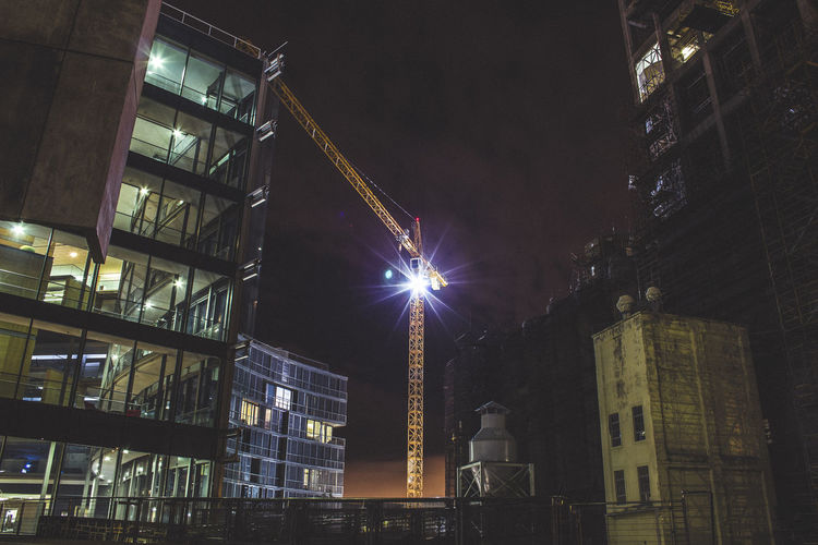 Low angle view of illuminated building at night