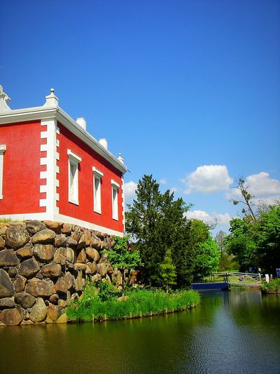 Scenic view of calm lake against blue sky