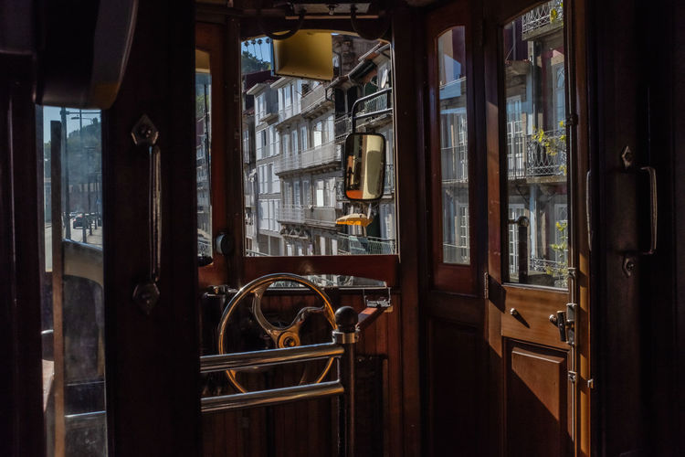 Interior of an old historical tram in porto portugal. steering and front mirror. 