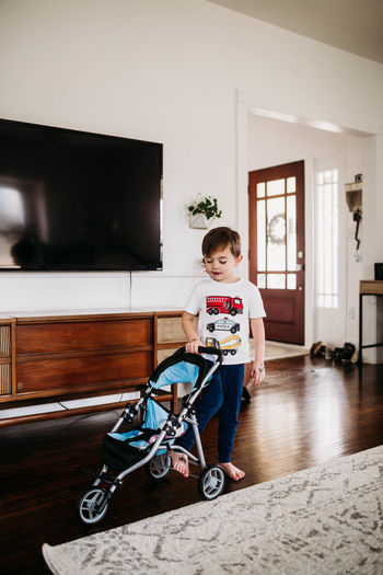 Portrait of boy standing at home