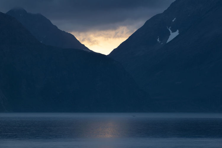 Scenic view of mountains against sky during sunset