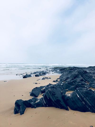 Scenic view of sea against sky during winter