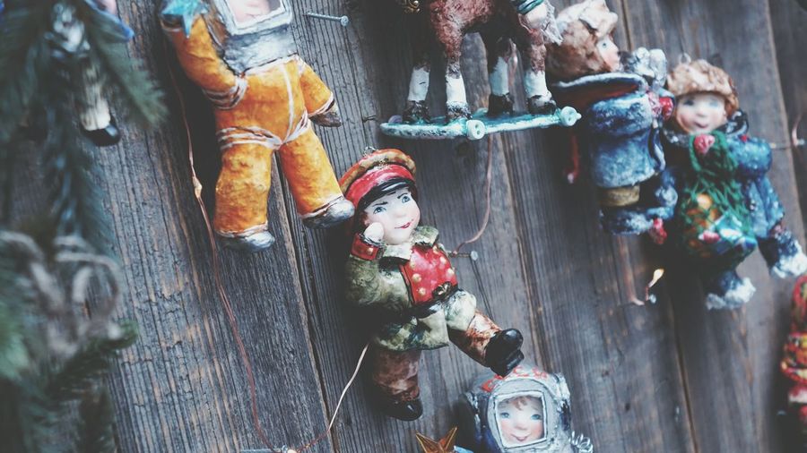 Various toys hanging on wood
