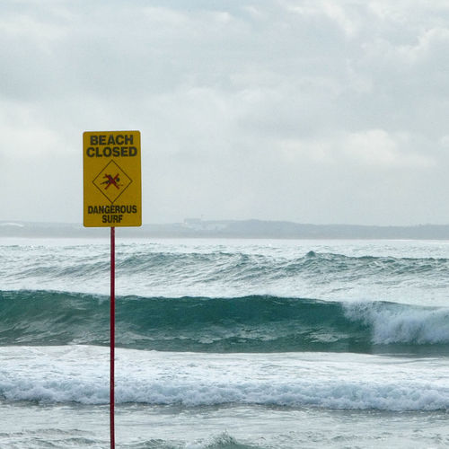 Warning sign,beach closed, dangerous surf