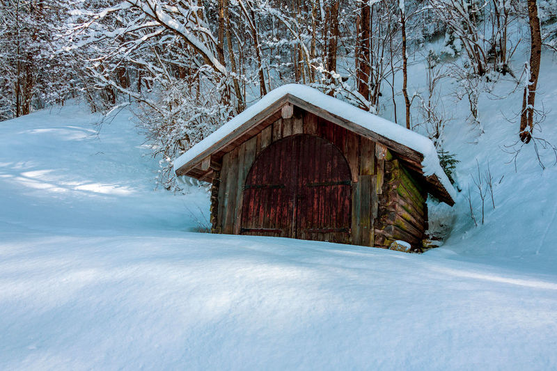 View of frozen house in winter