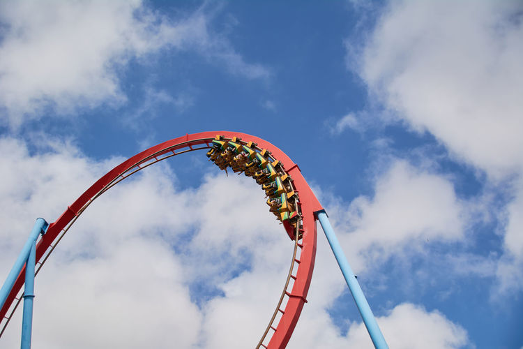 Low angle view of amusement park ride against sky