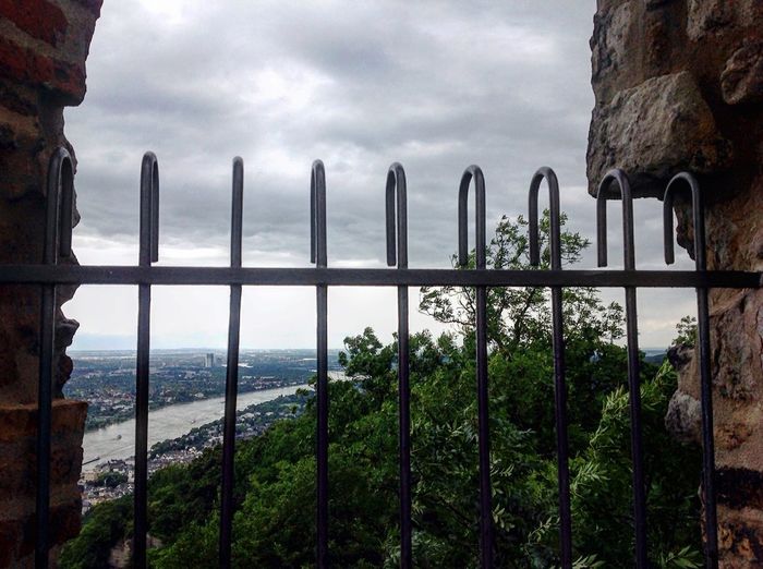 City seen through metal fence