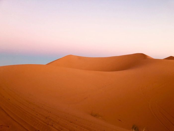 Scenic view of desert against clear sky