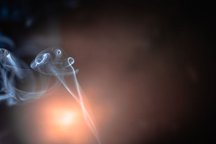 Close-up of smoke emitting from light