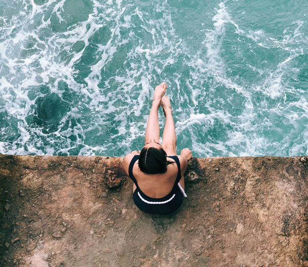 High angle view of young woman in sea