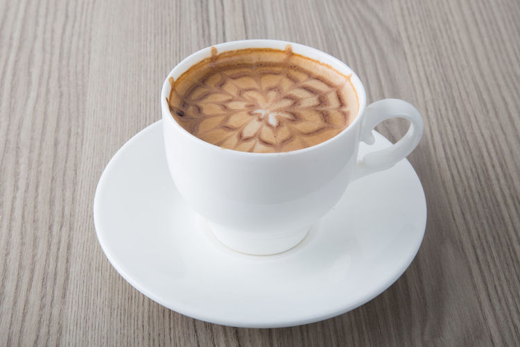 High angle view of cappuccino on table