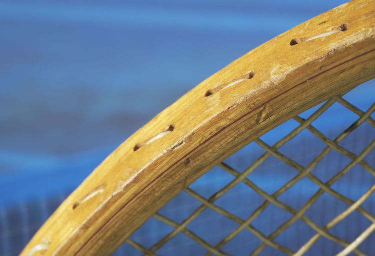 Close-up of wood against blue sea
