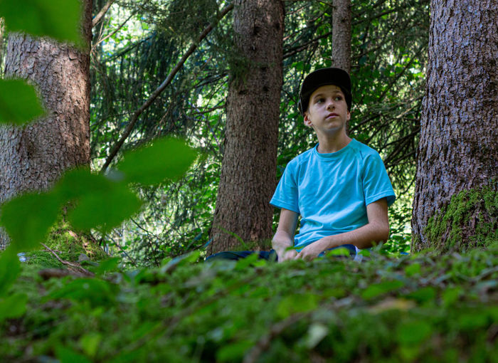 Portrait of boy in forest