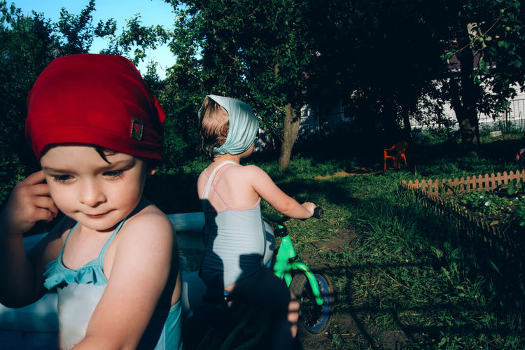 In summer, children ride bicycles in nature. childhood and active healthy lifestyle.