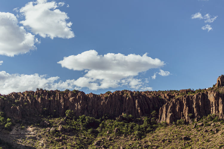 Scenic view of rocky mountains against sky
